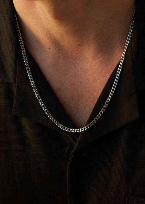 Mens jewelry Caltian stainless steel 4mm cuban chain necklace on model with black shirt