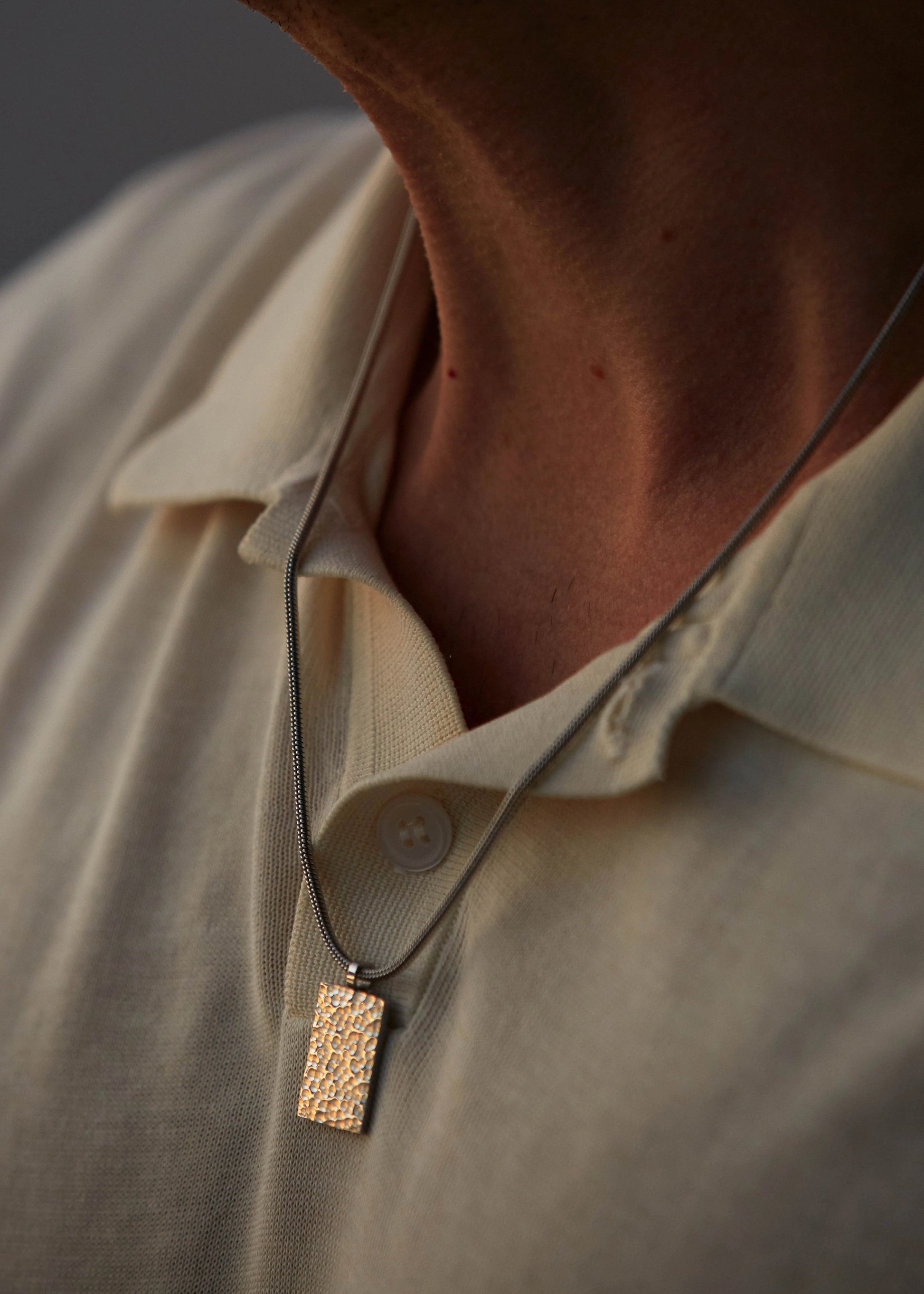 Mens jewelry Caltian stainless steel 2mm snake chain necklace on model with white t-shirt